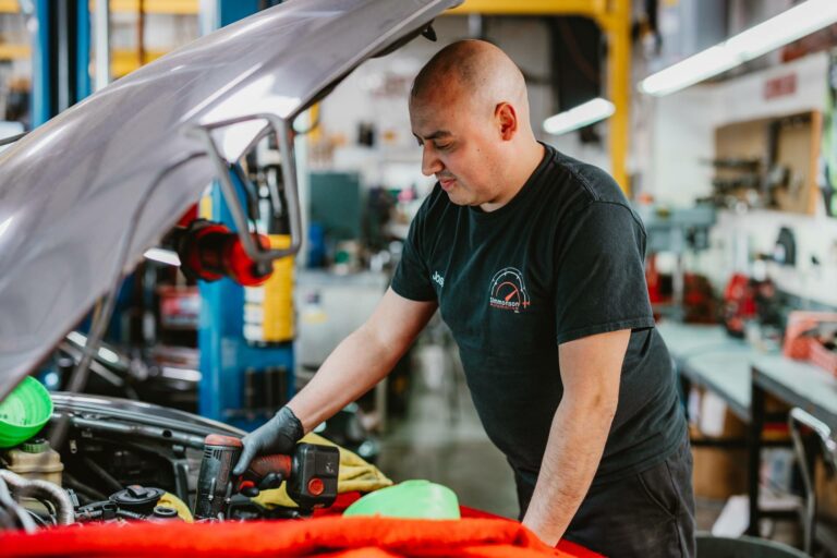 Simmonson Auto mechanic servicing an Audi