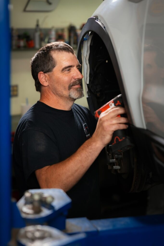 Simmonson Auto technician checking jeep repair issue